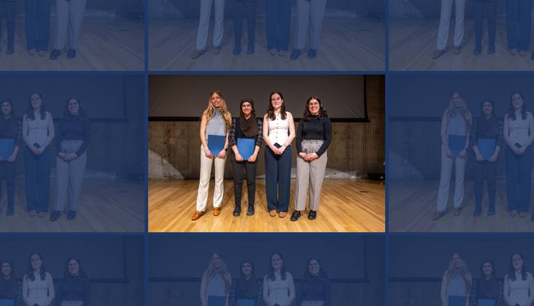 Winners of the 2025 U of T 3MT finals stand on a stage in front of a screen.